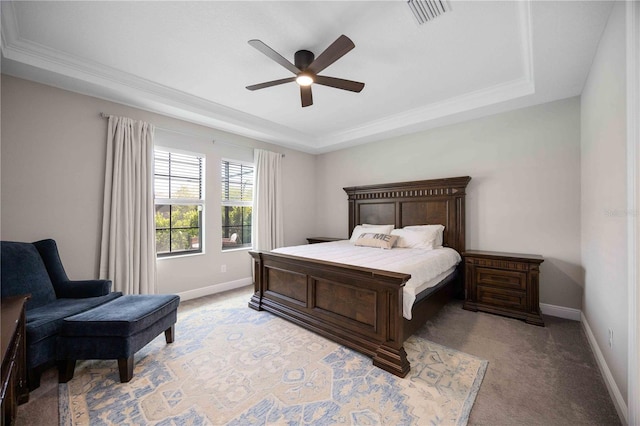 bedroom featuring a tray ceiling, ceiling fan, and light colored carpet