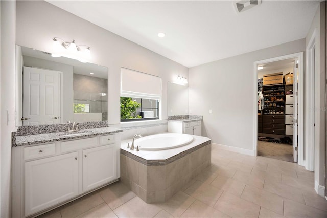 bathroom with vanity, independent shower and bath, and tile patterned flooring