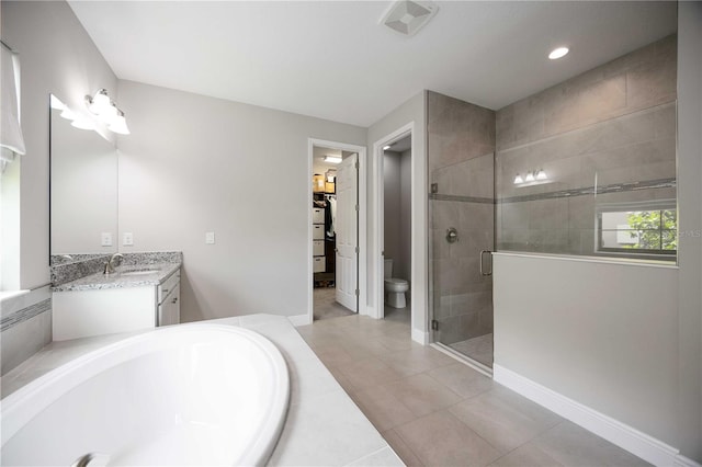 full bathroom featuring tile patterned floors, plus walk in shower, toilet, and vanity