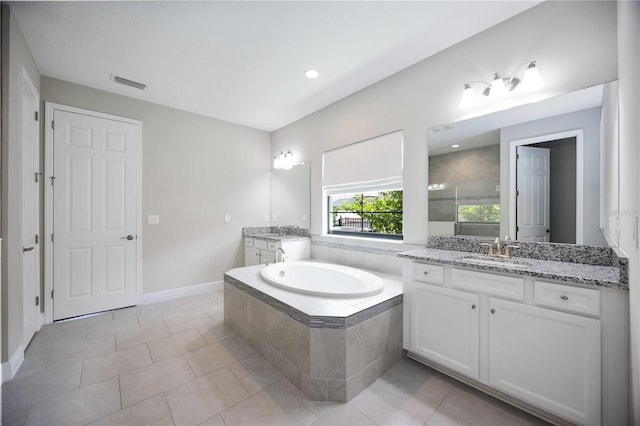 bathroom with separate shower and tub, tile patterned flooring, and vanity