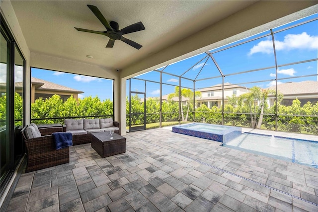 exterior space featuring an in ground hot tub, glass enclosure, and outdoor lounge area