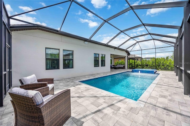 view of pool featuring an outdoor living space, pool water feature, a lanai, and a patio area