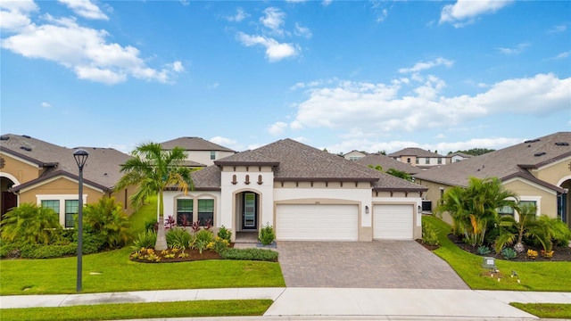 view of front facade featuring a front lawn and a garage