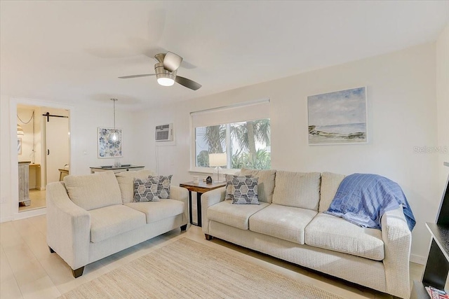 living room featuring a wall mounted air conditioner and ceiling fan