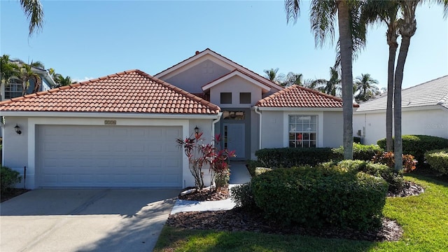 mediterranean / spanish-style home featuring a garage