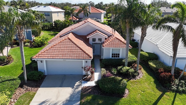 view of front of home with a garage and a front yard