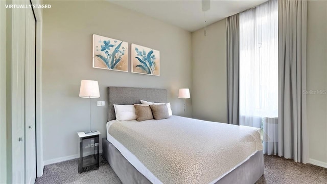 bedroom featuring light colored carpet