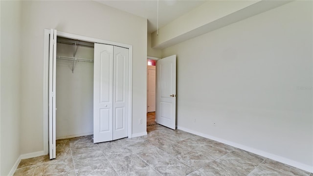 unfurnished bedroom featuring a closet