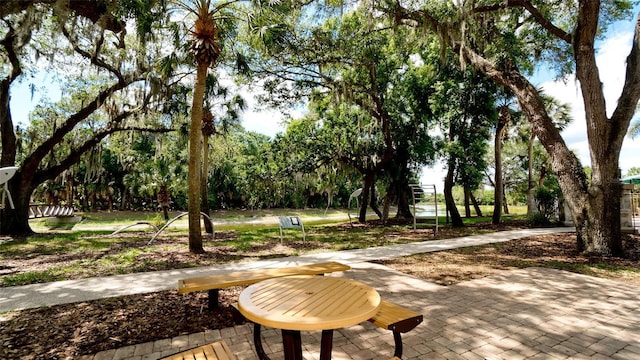 surrounding community with a patio area