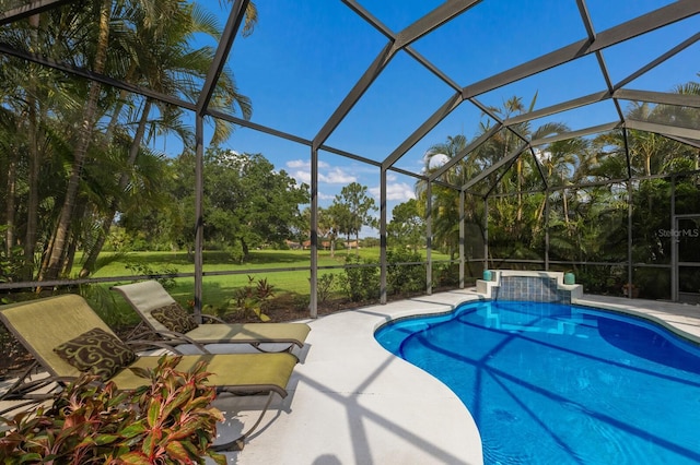 outdoor pool featuring a lanai and a patio