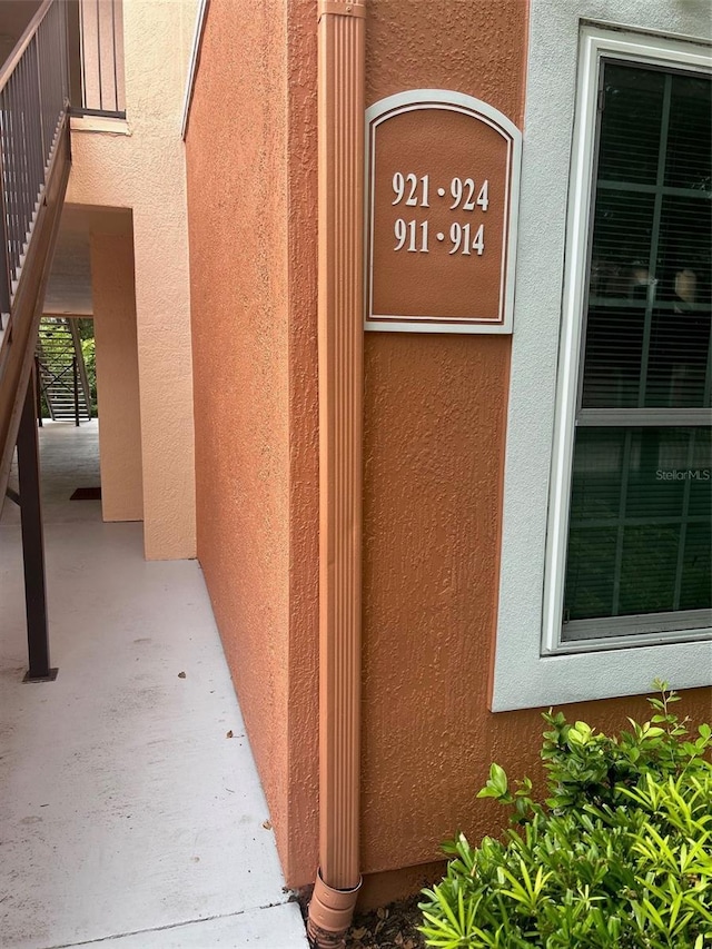 entrance to property featuring stucco siding