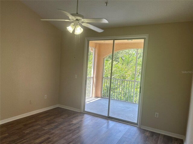 empty room with ceiling fan, wood-type flooring, and a wealth of natural light