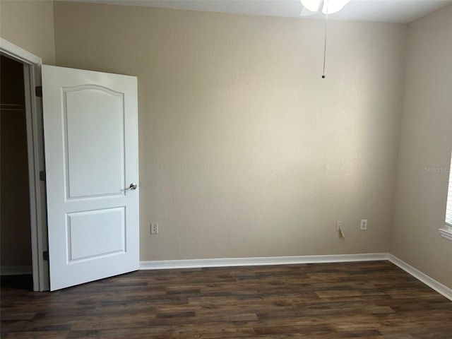 empty room featuring dark wood-type flooring