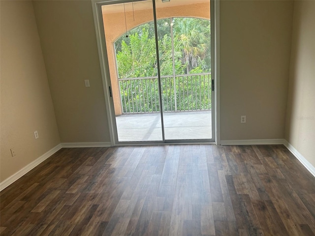 empty room featuring hardwood / wood-style floors and a healthy amount of sunlight