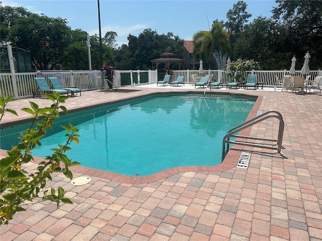 view of pool with a patio area and a gazebo