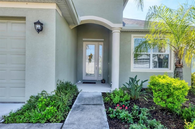 view of exterior entry featuring a garage