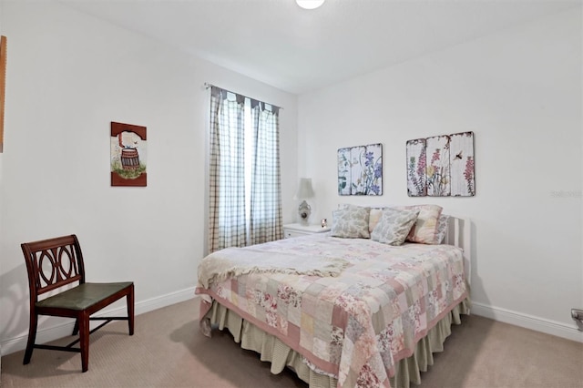 bedroom with light carpet