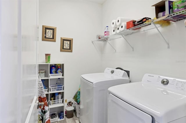 clothes washing area with washer and dryer