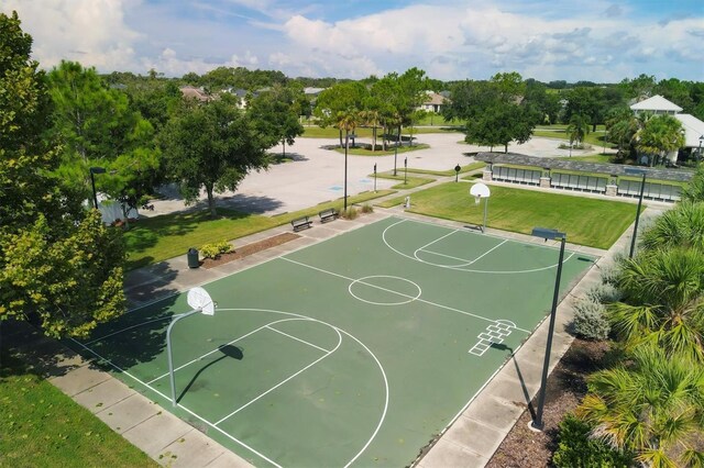 view of sport court featuring a yard