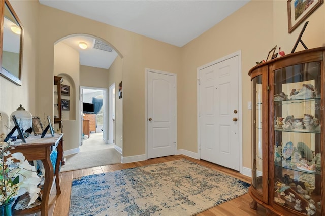 view of carpeted foyer entrance