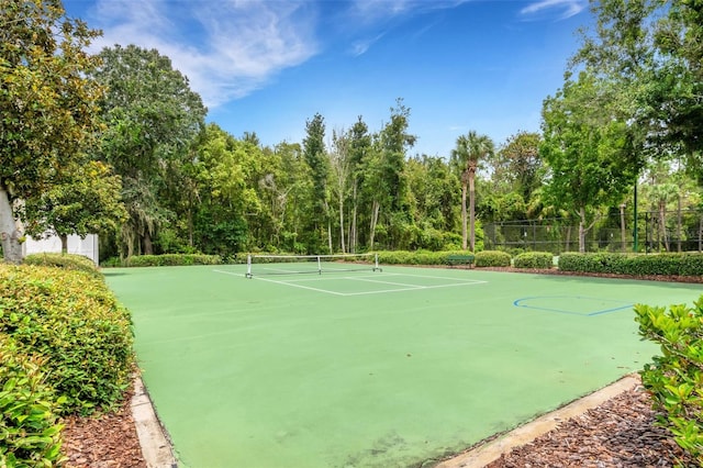 exterior space with tennis court