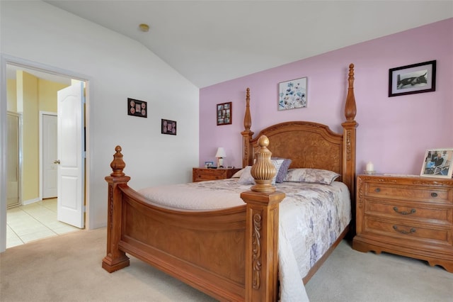 carpeted bedroom featuring lofted ceiling