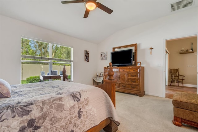 carpeted bedroom featuring ceiling fan and vaulted ceiling