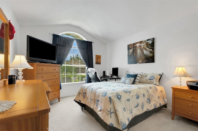 carpeted bedroom with vaulted ceiling