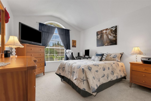 bedroom featuring lofted ceiling and light colored carpet