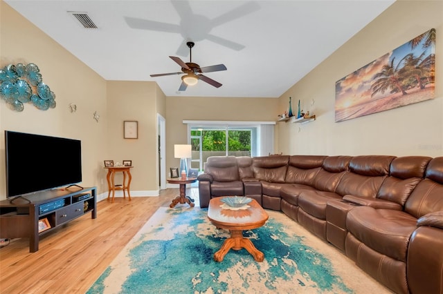 living room featuring light hardwood / wood-style flooring and ceiling fan