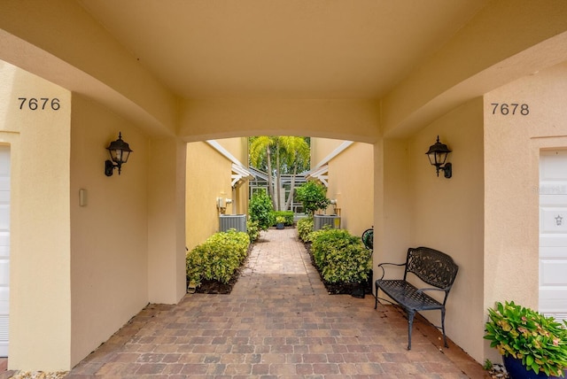 doorway to property with a patio and a garage