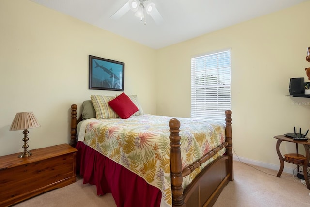 bedroom with light carpet and ceiling fan