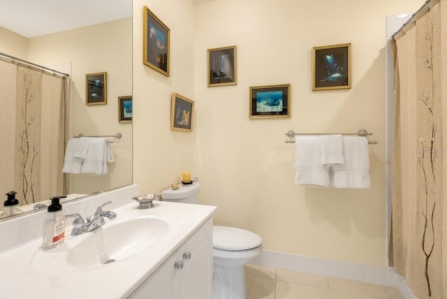 bathroom featuring vanity, toilet, and tile patterned flooring