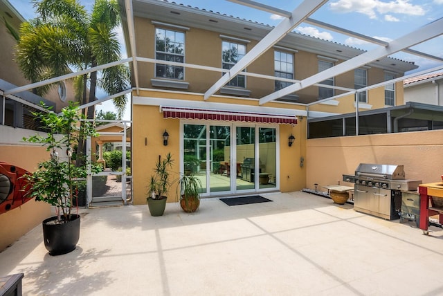 rear view of property featuring a patio