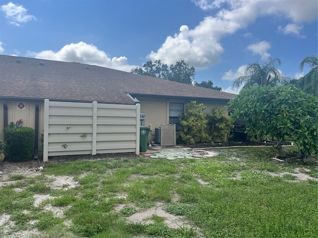 back of house with a yard