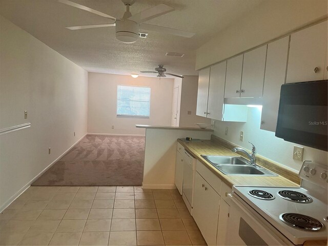 kitchen featuring ceiling fan, sink, white appliances, light carpet, and white cabinets