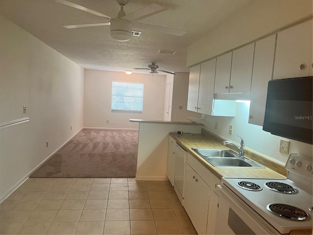 kitchen with sink, white appliances, ceiling fan, a textured ceiling, and white cabinets