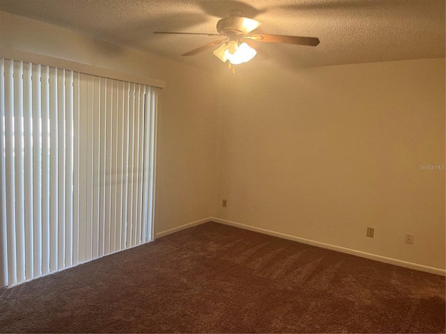 empty room featuring carpet flooring, ceiling fan, and a textured ceiling