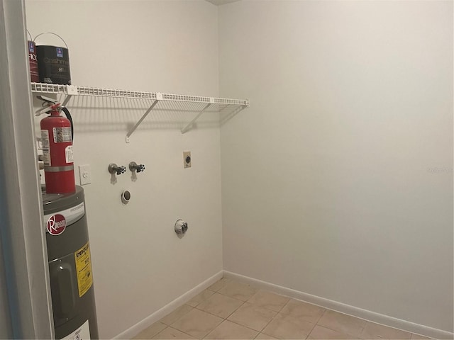 washroom with hookup for a washing machine, light tile patterned floors, electric dryer hookup, and water heater