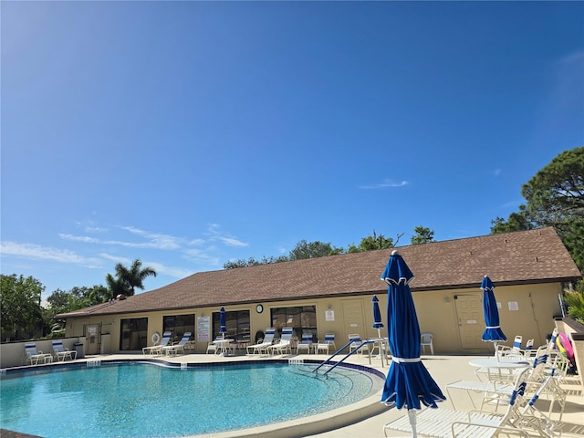 view of swimming pool featuring a patio area