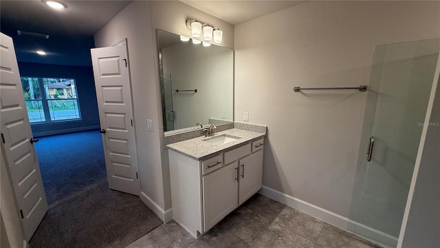 bathroom with vanity and walk in shower