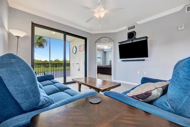 living room featuring ceiling fan and ornamental molding