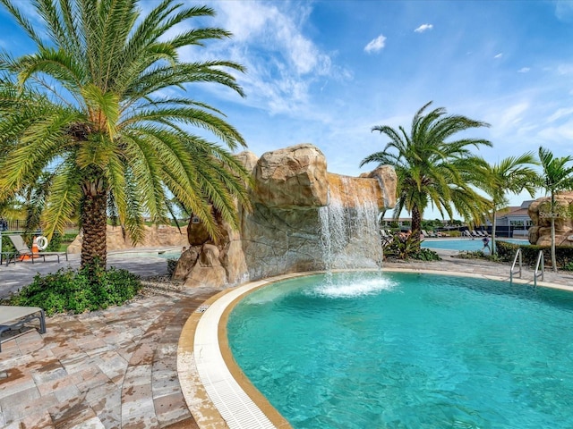 view of pool featuring pool water feature