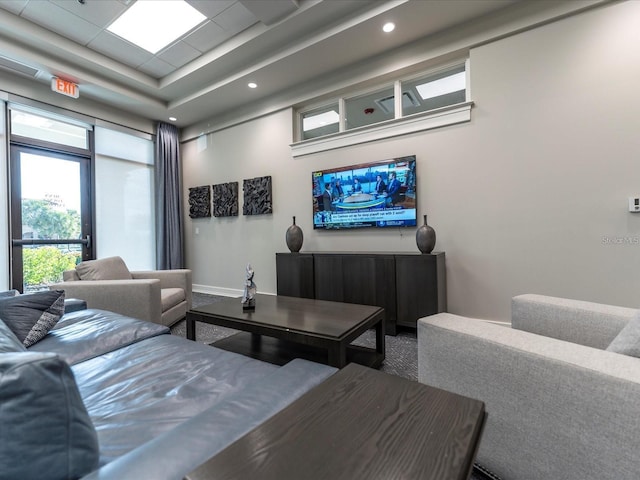 living room with a tray ceiling