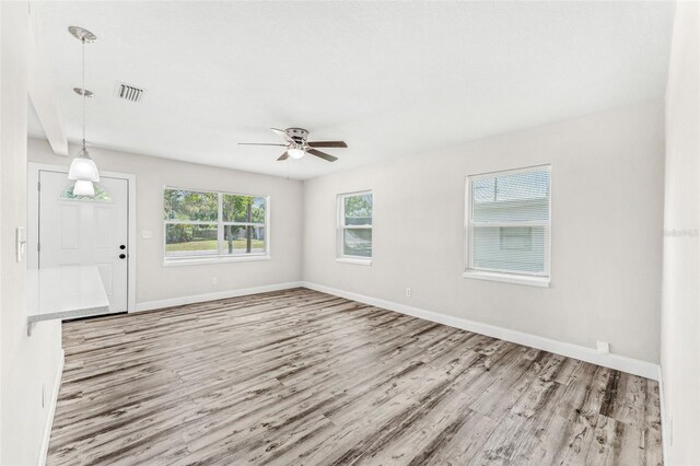 spare room with ceiling fan and hardwood / wood-style floors