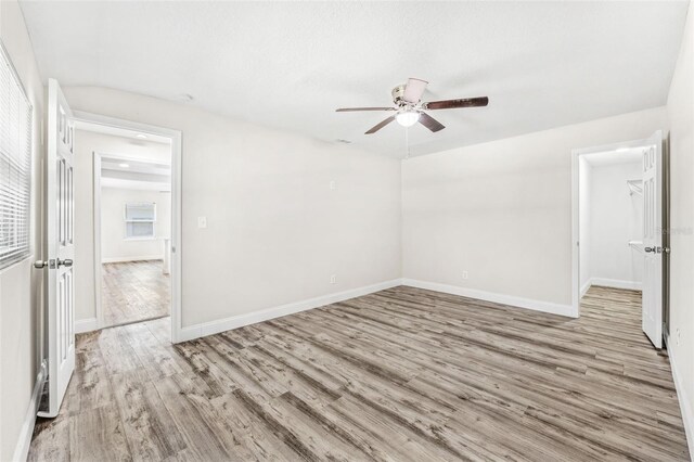 unfurnished room with ceiling fan and light hardwood / wood-style flooring