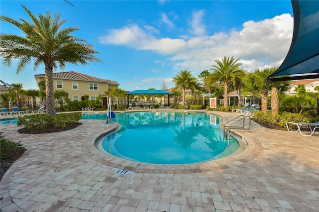 view of swimming pool with a gazebo and a patio area