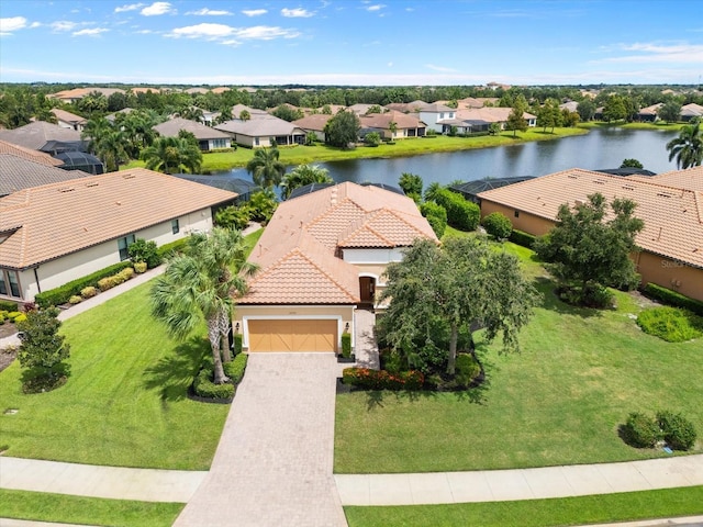 birds eye view of property featuring a residential view and a water view