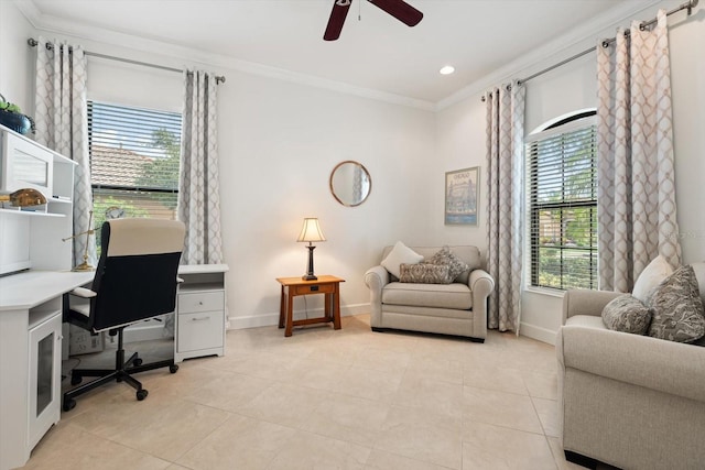 office area with a wealth of natural light, crown molding, ceiling fan, and light tile patterned floors