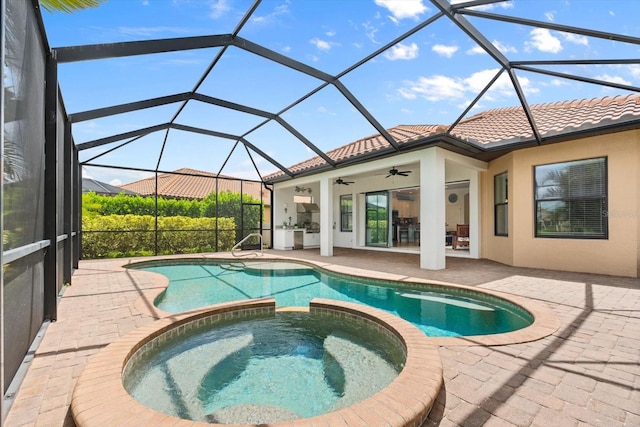 view of pool featuring a patio, ceiling fan, a lanai, and an in ground hot tub